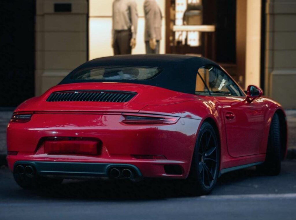 Red Porsche - Experience the thrill of driving a high-performance red Porsche with our authorized Porsche service.