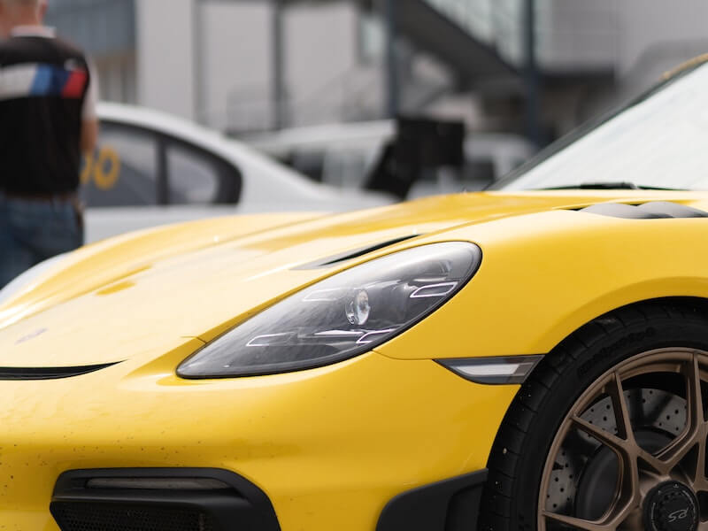 ellow Porsche Car - Experience the vibrant thrill of a yellow Porsche car, exemplifying luxury and high-performance engineering.