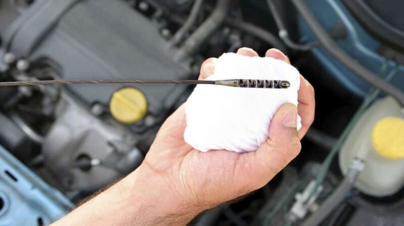 remove and clean engine oil dipstick for accurate oil level reading